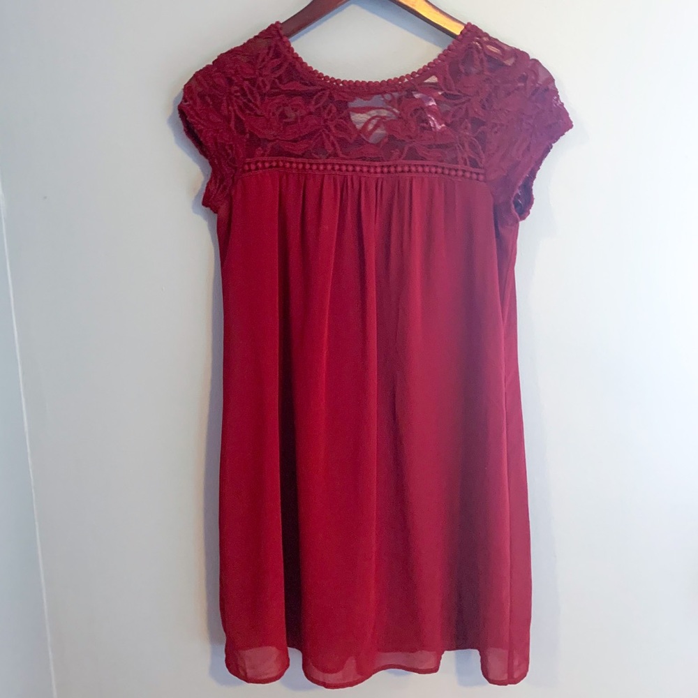 Francesca’s Alya burnt red dress with lace details